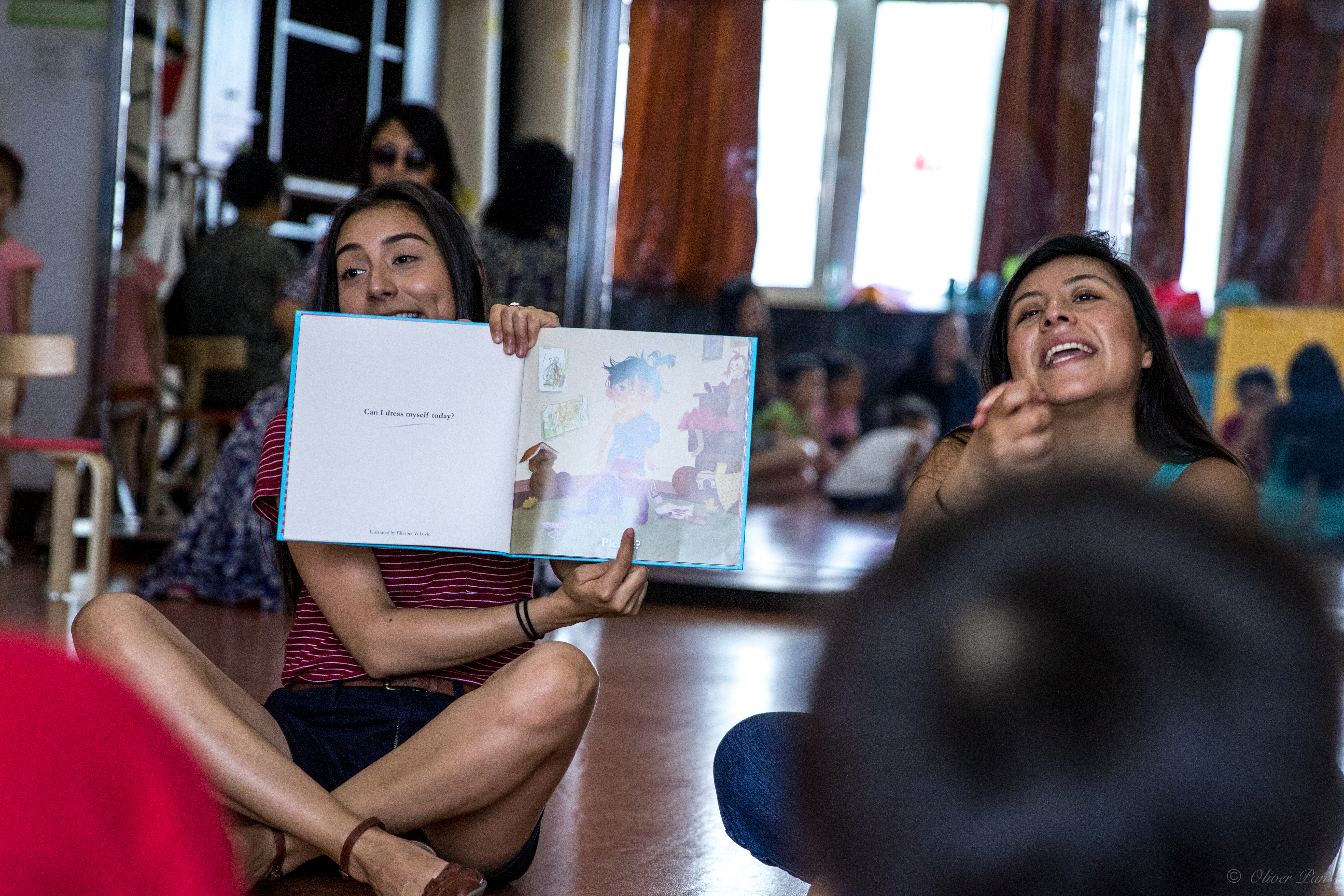 Teachers reading to kids