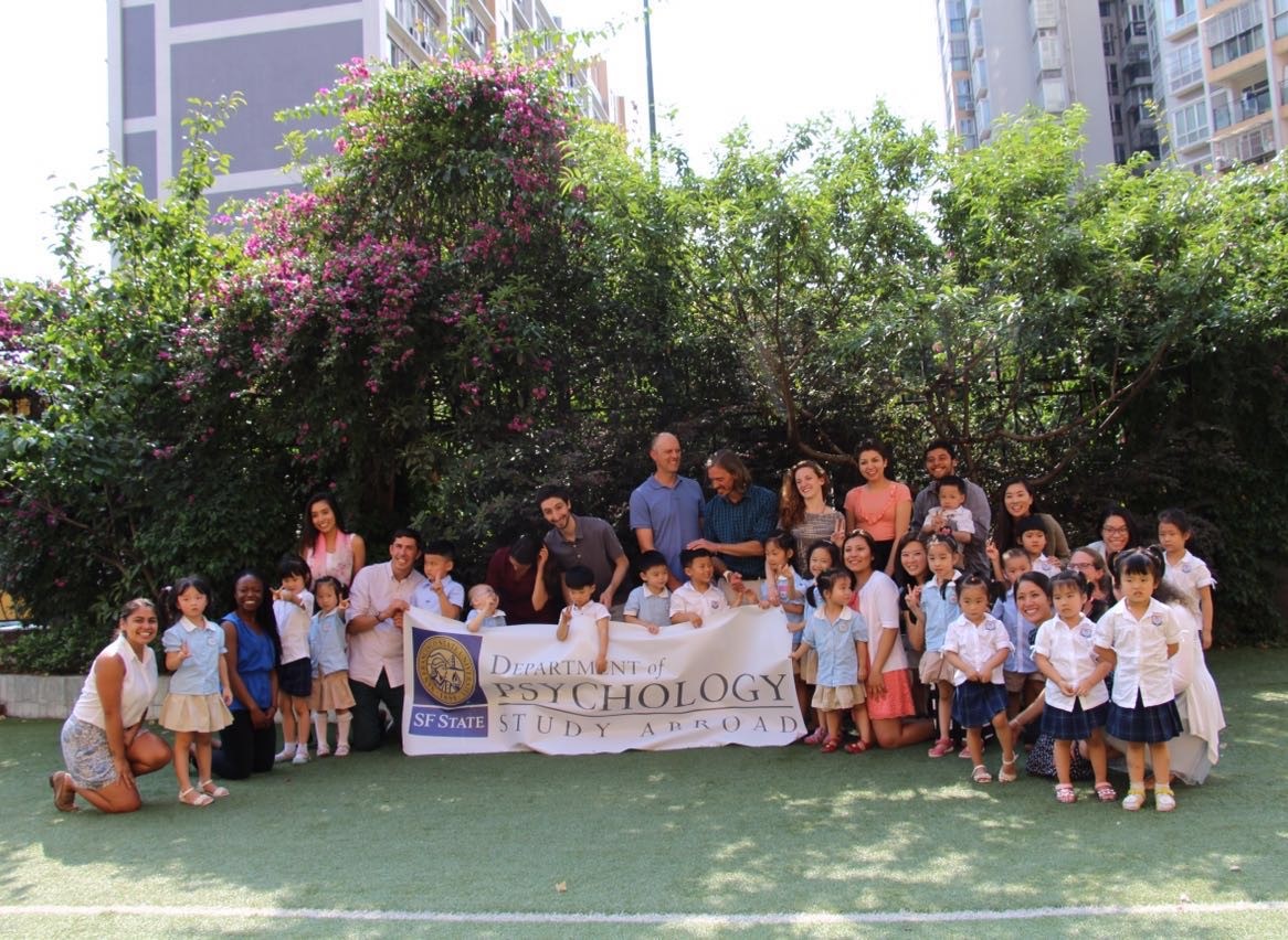 Group photo with kids in China after our first day of teaching